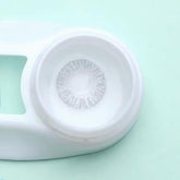 a close up of a white frisbee on a table